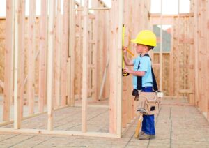 A young boy dreams of being a construction worker and building things.